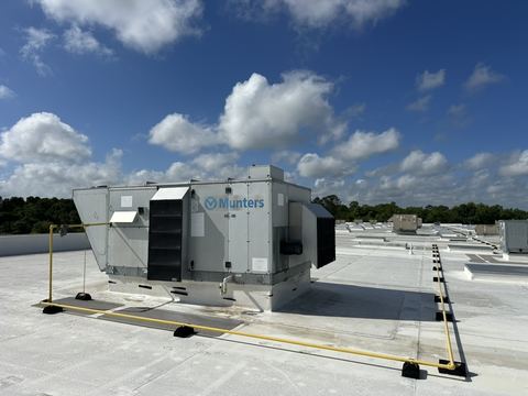 Rooftop commercial HVAC units on a service building