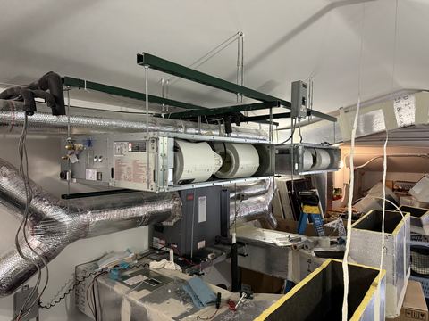 Ductwork installation at a commercial construction site